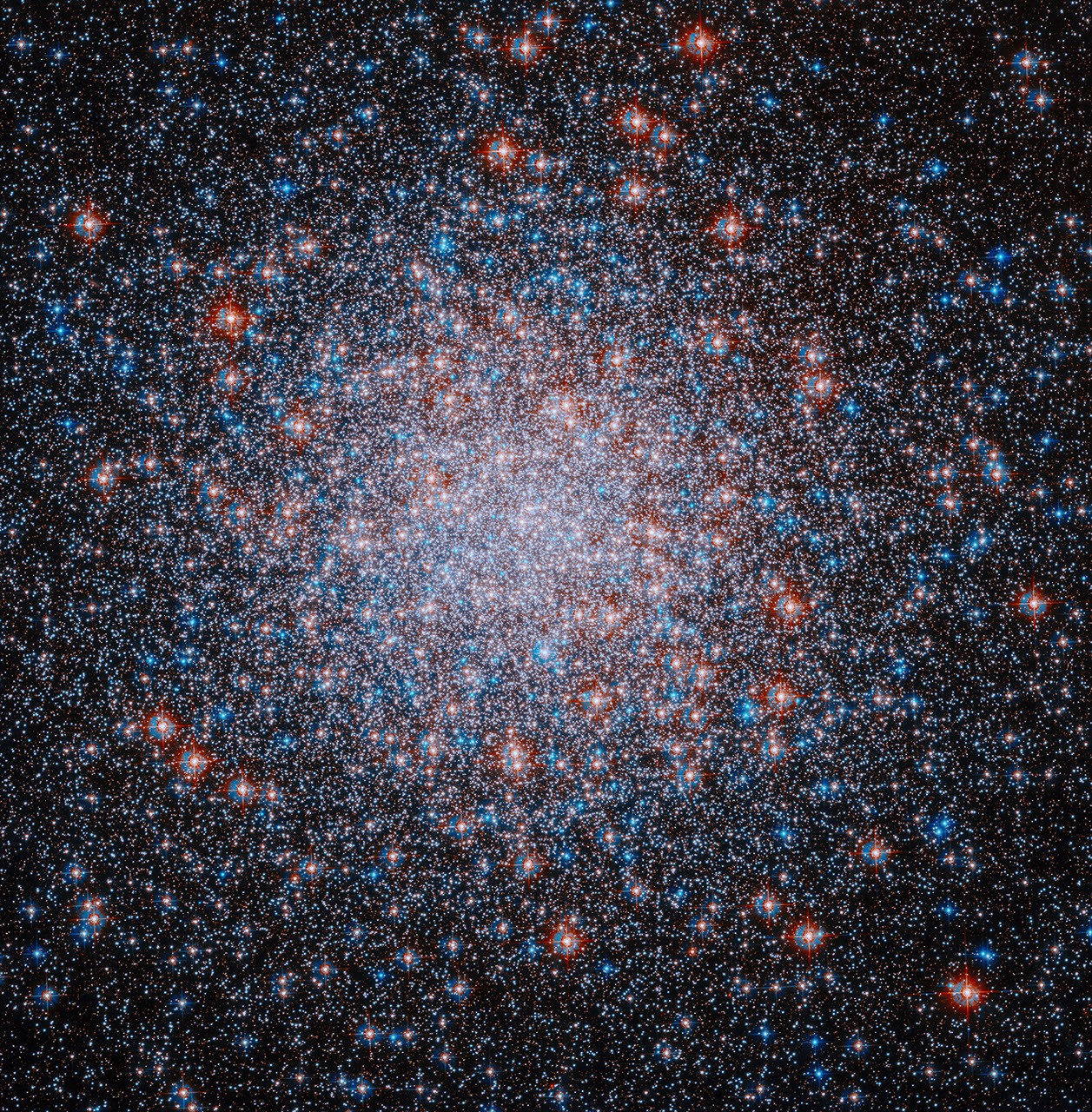 NASA’s Hubble Spots Star-Spangled Cosmic Scene