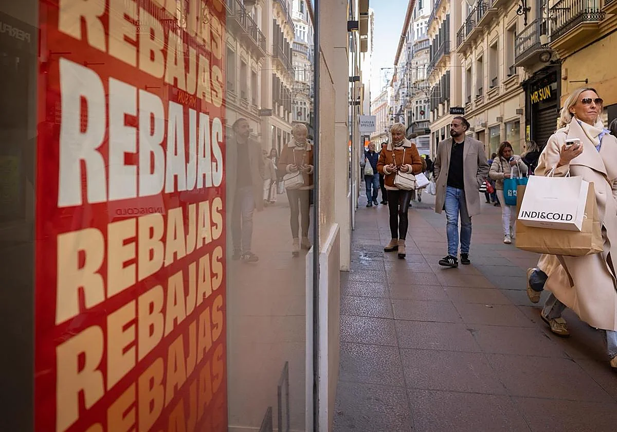 Are shops and shopping centres in Malaga province open on Sunday, 11 January?